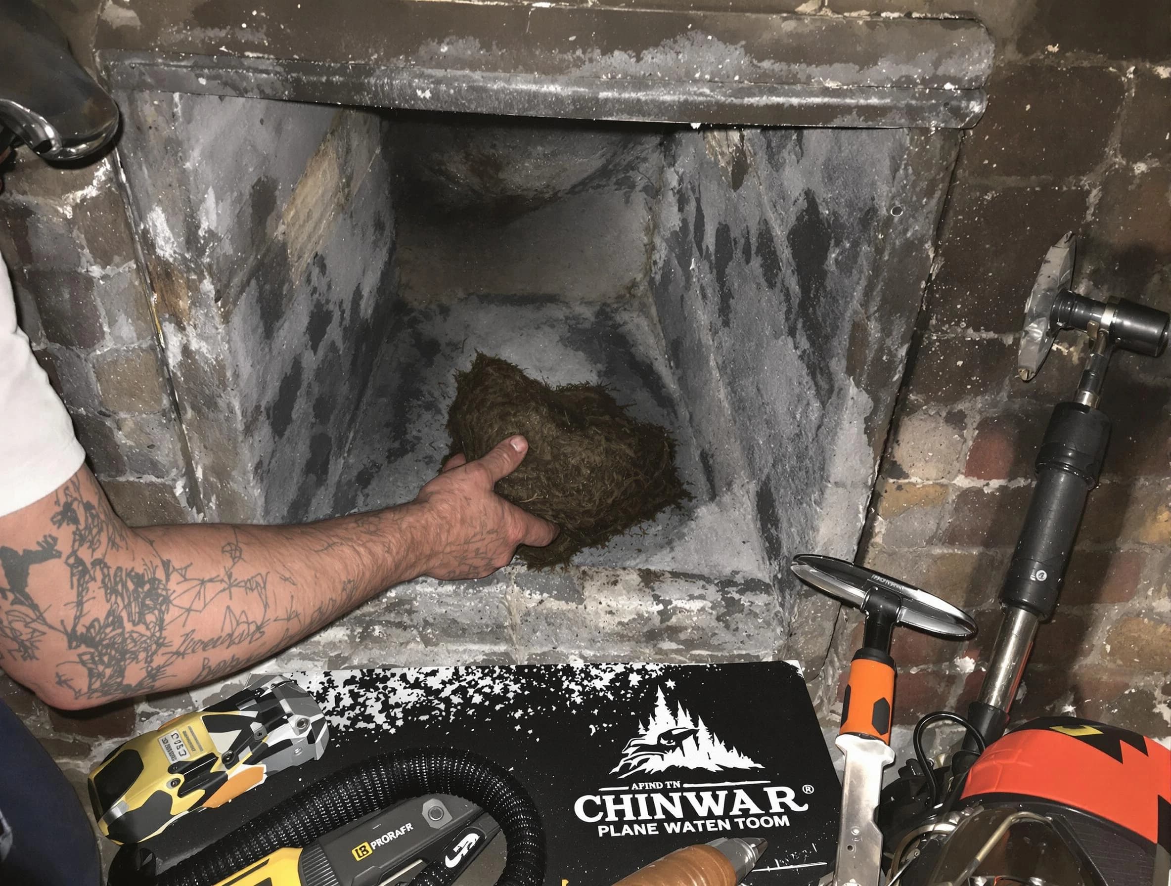 Roy Chimney Sweep safely removing debris and screening chimney in Roy, UT